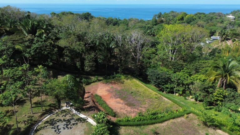 Aerial view of Lot 01 at Farmstead Collection, a cleared 0.38-acre creek-side homesite near Uvita, Costa Rica