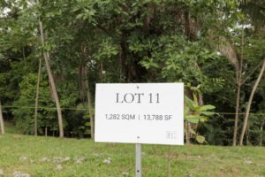 Lot 11 marker sign at Farmstead Collection, a 1,282 m2 jungle homesite